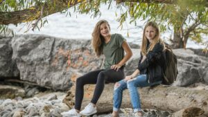 two girls sitting down